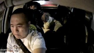 A couple performs oral sex in a taxi.